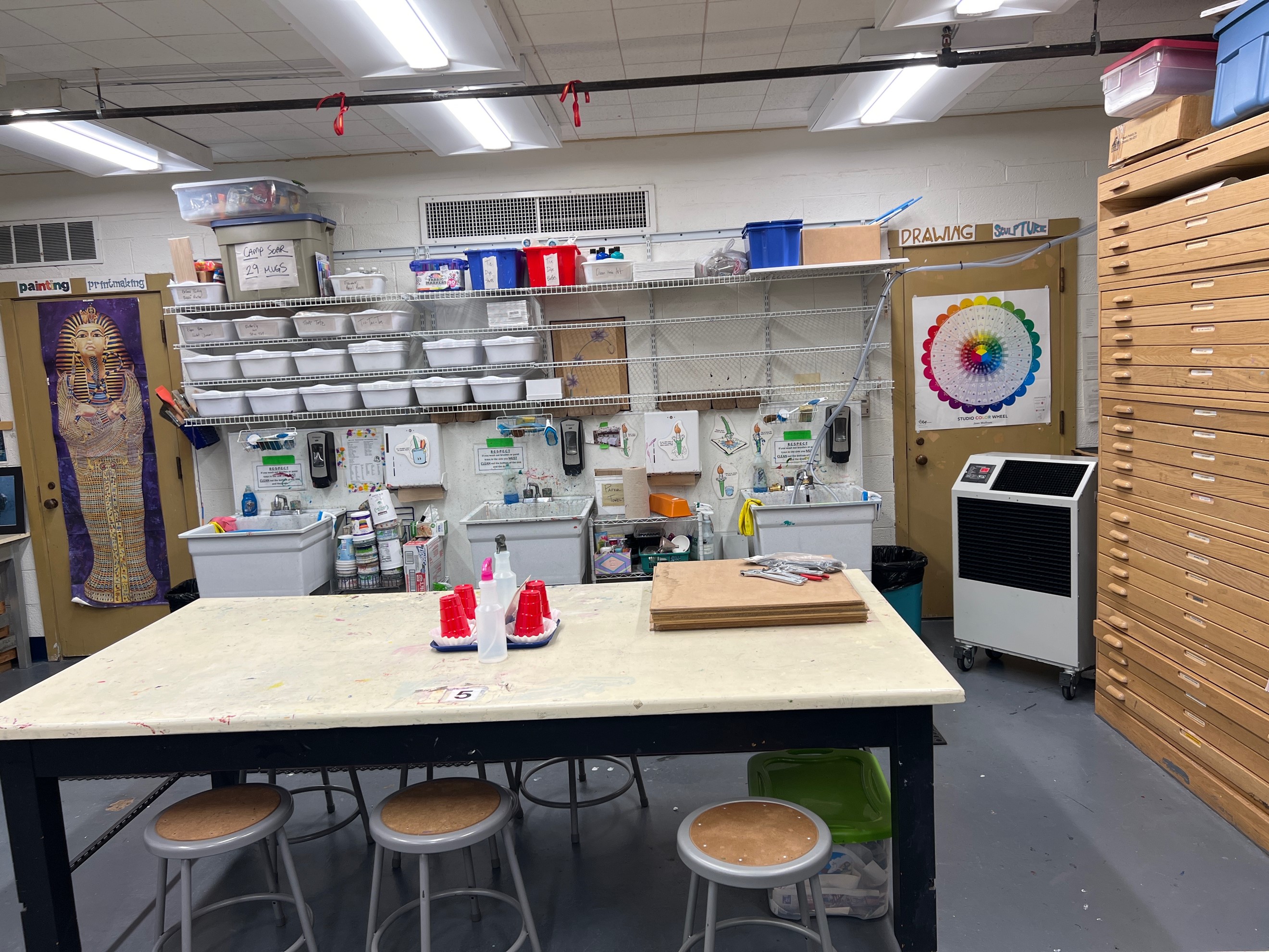 A Porta-Air portable water cooler positioned in a school art room piped into a sink. A Porta-Air portable water cooler positioned in a school art room piped into a sink.